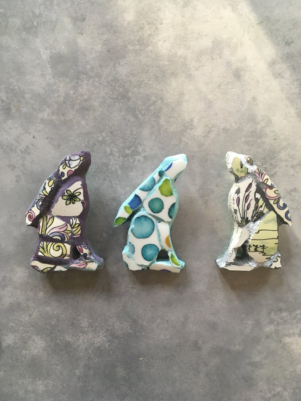 Three small mosaic hare brooches in patterned vintage china